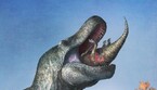 Un T-rex con le labbra divora un giovane edmontosauro (fonte: Mark P. Witton) (ANSA)