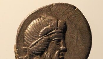 Il dio Bacco ritratto su un’antica moneta romana (fonte: Università di Liverpool) (ANSA)