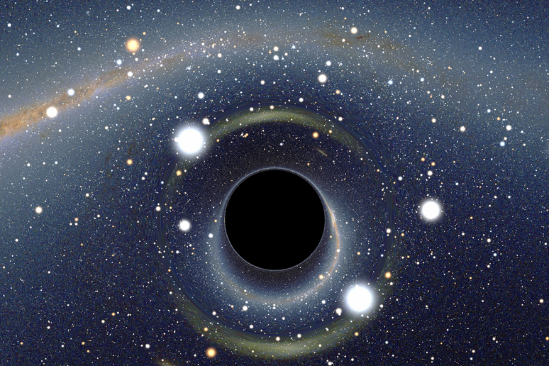 Rappresentazione grafica di un buco nero davanti alla Grande Nube di Magellano - RIPRODUZIONE RISERVATA