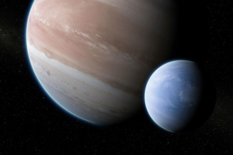 Rappresentazione artistica del pianeta esterno al Sistema Solare Kepler-1625b con la sua luna (fonte: Dan Durda) - RIPRODUZIONE RISERVATA
