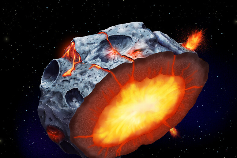 Rappresentazione artistica di un asteroide metallico (fonte: Elena Hartley) - RIPRODUZIONE RISERVATA