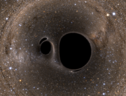 Simulazione al computer di due buchi neri che stanno per entrare in collisione (fonte: SXS Lensing/Simulating eXtreme Spacetimes Collaboration) (ANSA)