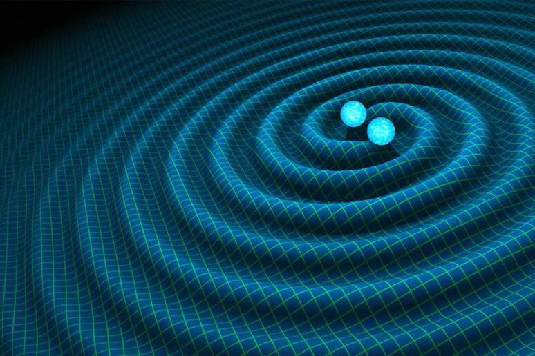 Rappresentazione grafica delle onde gravitazionali generate dalla collisione di due stelle di neutroni (fonte: R. Hurt/Caltech-JPL) - RIPRODUZIONE RISERVATA